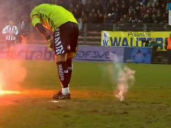 
	VIDEO Imagini INCREDIBILE! Portarul lui Charleroi, atacat cu torte de fani! I s-a facut rau pe teren

