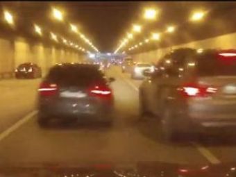 
	VIDEO Cursa pe drum public intre un Audi si un BMW! Nu s-a incheiat bine! PANICA maxima intr-un tunel din Rusia!
