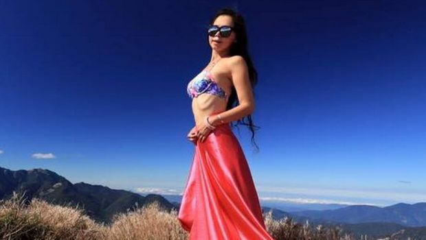 
	Gigi WU, modelul care se catara in bikini pe munti, a murit dupa ce a cazut intr-o rapa. FOTO

