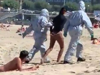 
	Scena IREALA pe o plaja din Spania. O tanara infectata cu COVID-19 s-a dus sa faca SURF. A fost luata din apa si INCATUSATA!
