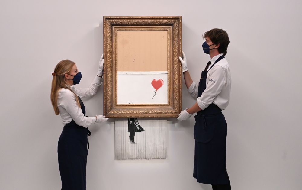 "Fata cu balon" a lui Banksy a fost vândută pentru suma record de 18,6 milioane de lire sterline. Cum arată creația_1